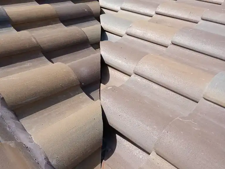 New concrete tile meeting the old roof at a valley during a tile re-roof in Royal Palm Beach