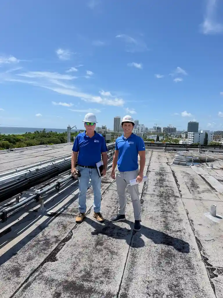 Merrick and Dell of Molsbee Roofing on a commercial flat roof