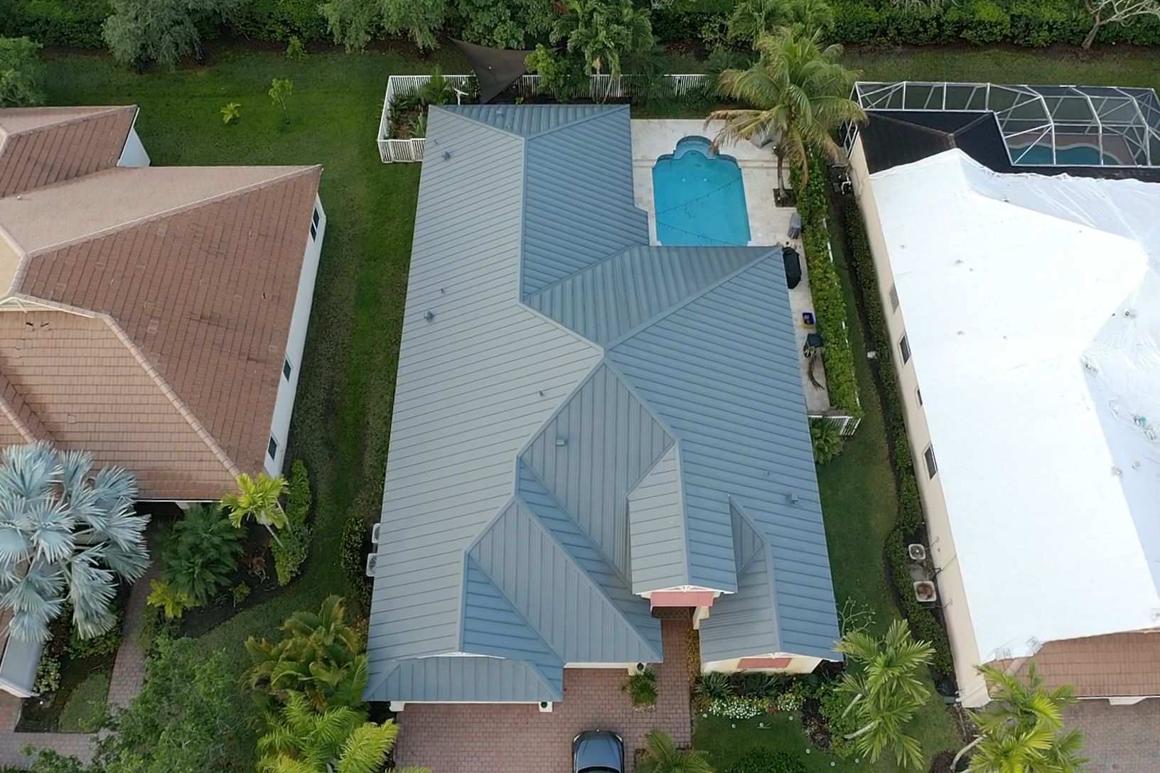 Metal roof aerial view over pool home