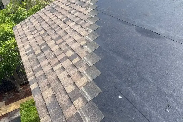 Architectural shingles going down over black self-adhered underlayment on a re-roof