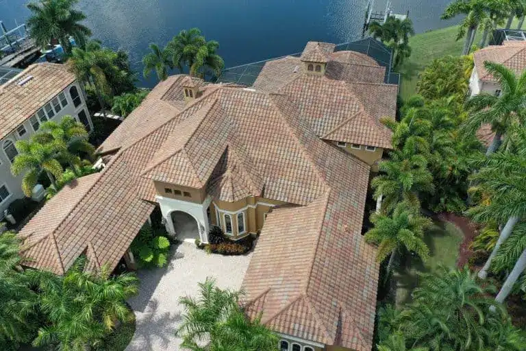 Barrel tile roof waterfront mansion