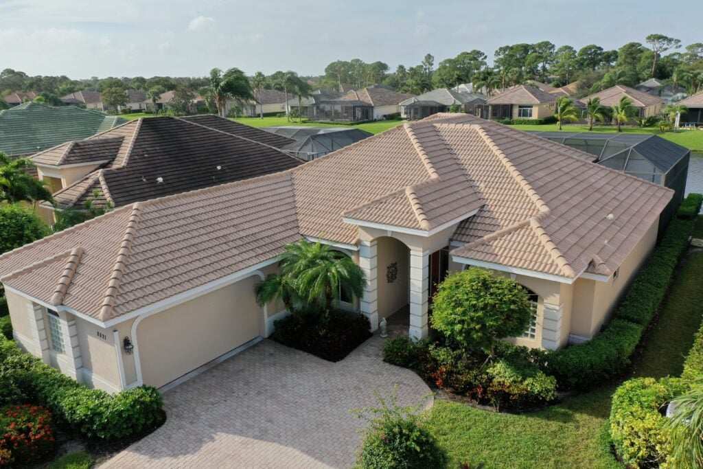 Tan tile roof home in golf community