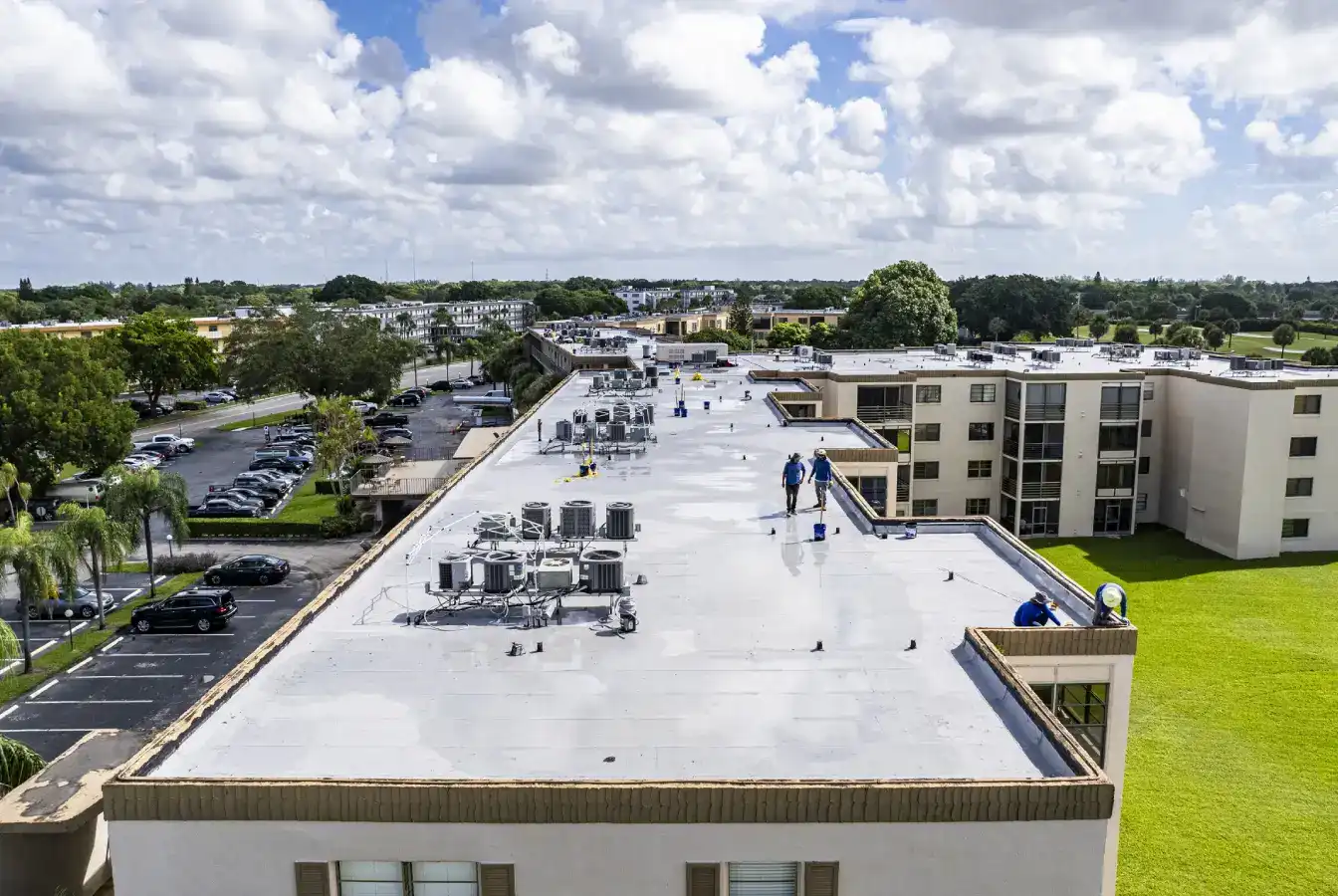 TPO roofing crew working on commercial building